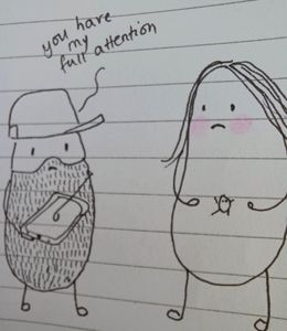 comic of little daddy and little mummy, daddy is saying you have my full attention to little mummy while he is playing on his iPad